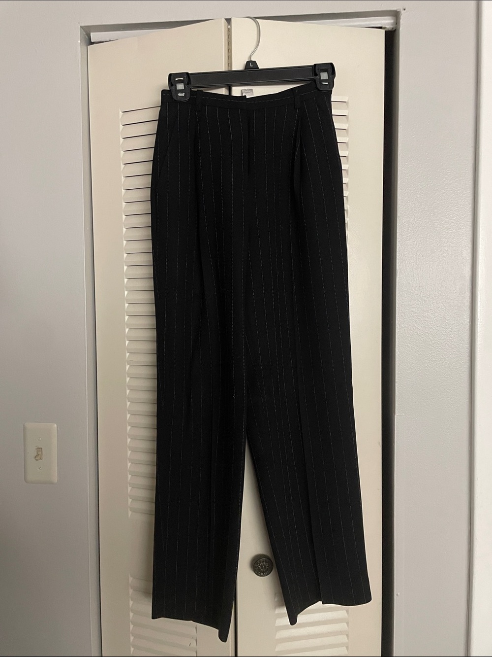 Women’s black pinstriped pantsuit